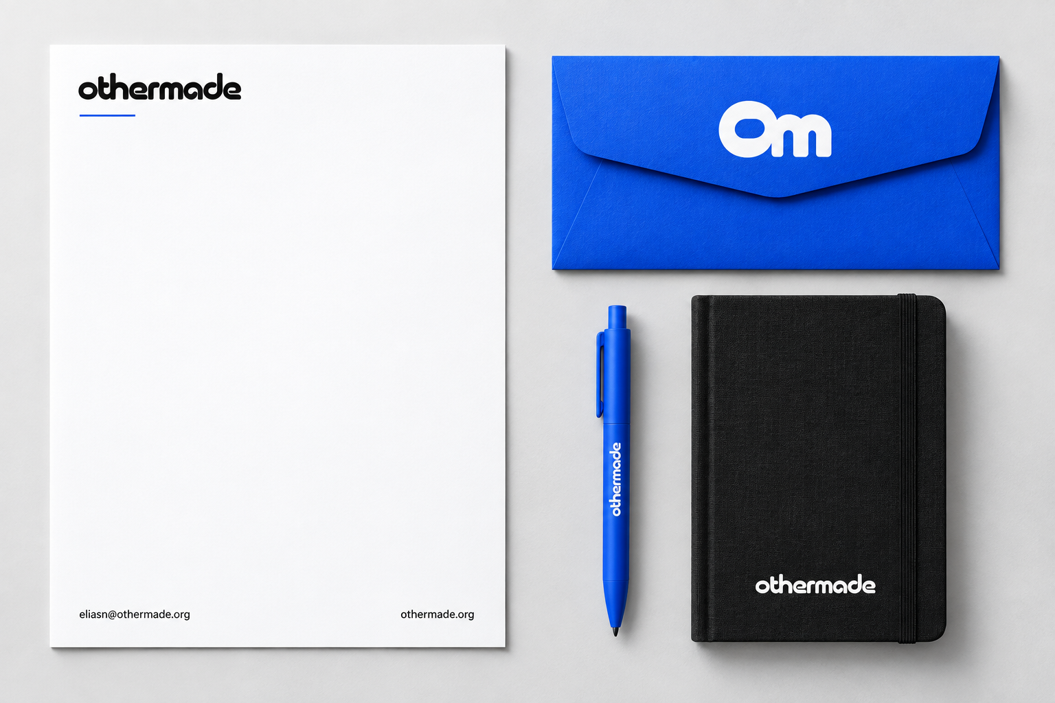 Othermade's connected mark on blue stationery and a black notebook